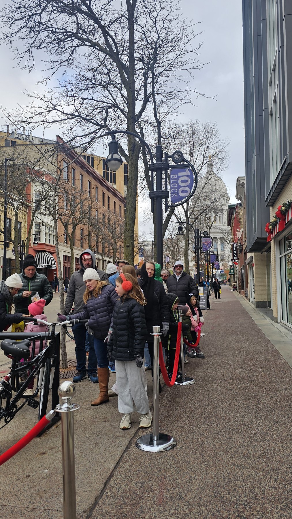 Visitors waiting along State Street to see Santa