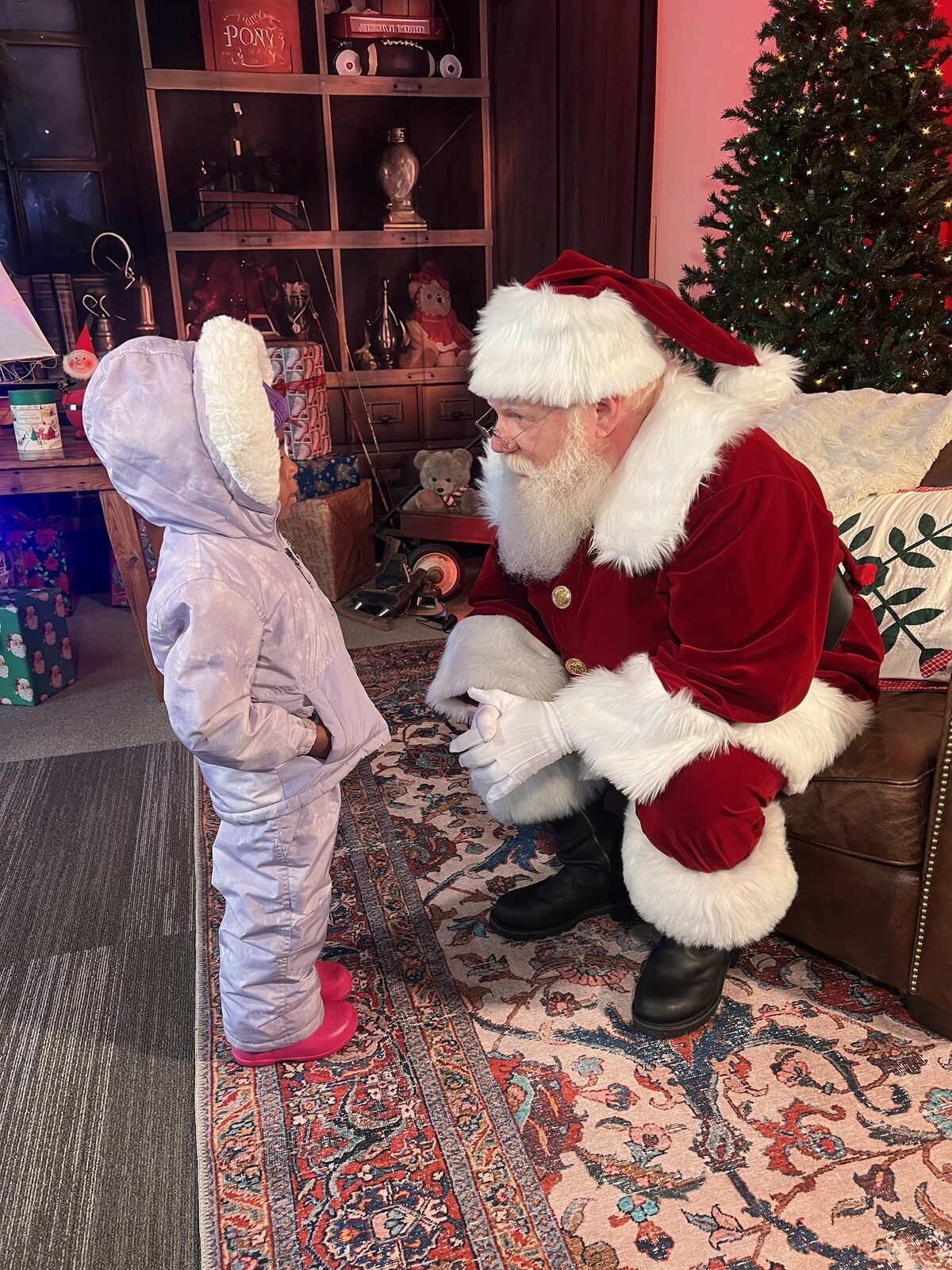 A toddler meeting Santa