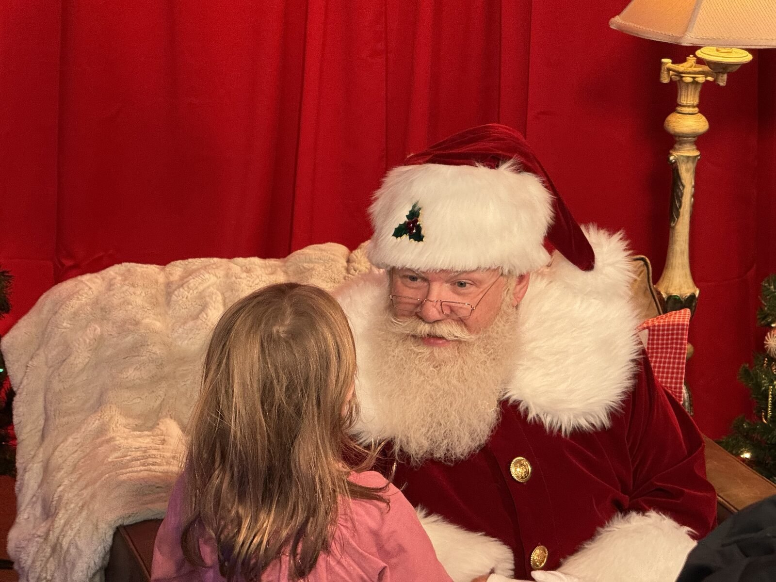 A child talking with Santa